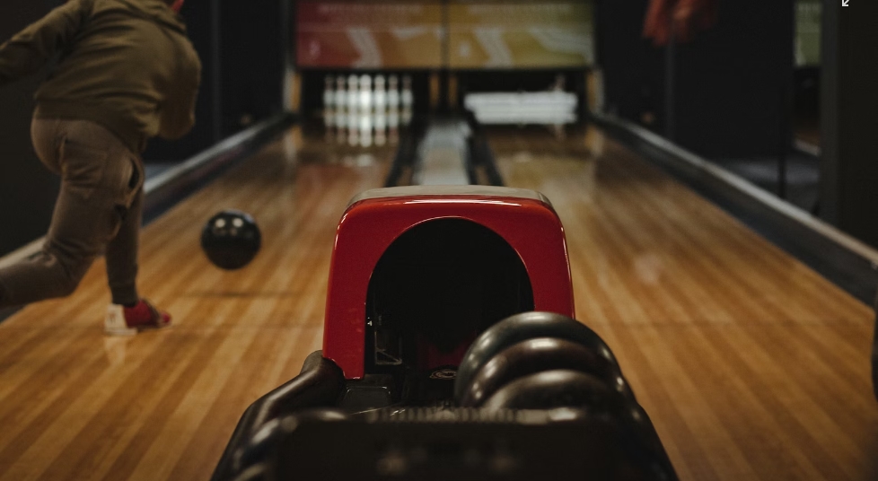 How to spin a bowling ball